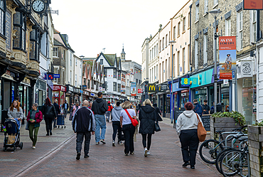 People shoppers walking along pedestrianised town centre street, Tavern Street, Ipswich, Suffolk, England, UK