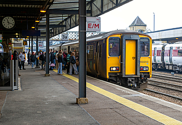 People boarding British Rail Class 150 Sprinter passenger train, Lincoln railway station, city of Lincoln, Lincolnshire, England, UK