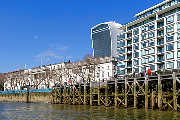 Mix of old and new buildings on River Thames waterfront, Lower Thames Street, City of London, England, UK