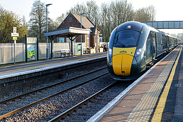 Great Western railway British Rail Class 800 Intercity Express Train arriving at platform of railway station, Pewsey, Wiltshire, England, UK