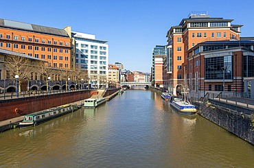 Narrow boats River Avon Floating Harbour, modern buildings, Temple Quarter regeneration, Bristol, England, UK view to Temple Bridge