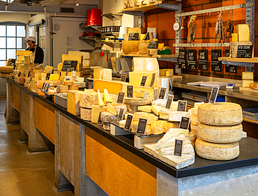 Interior of cheesemonger specialist cheese shop, Mons cheesemongers, East Dulwich, London, England, UK