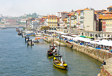 Market stalls selling tourist souvenirs, River Douro waterfront, Ribeira district, city of Porto, Portugal, Europe