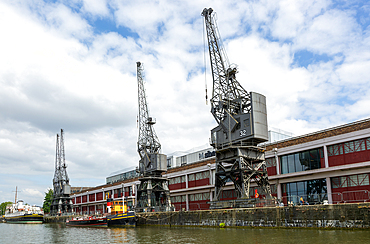 Stothert and Pitt 1950s electric cargo cranes on quayside of Floating harbour, M Shed museum, Bristol, England, UK