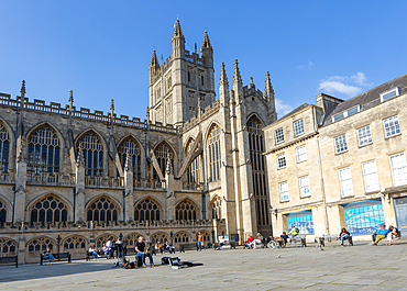 Busker musician performing in Bath Abbey church yard, city of Bath, north east Somerset, England, UK