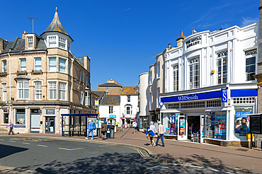 Street and shops including WH Smith in town centre of Teignmouth, south Devon, England, UK