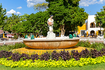 Female Mayan figure woman holding water jug in fountain, Francisco Cantón Rosado Park, Valladolid, Yucatan, Mexico, North America