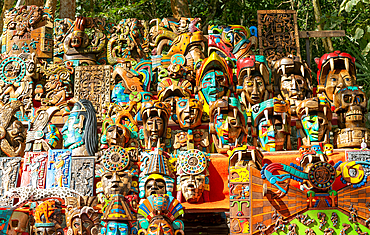 Souvenir wooden carved face masks on sale, Mayan ruins, Chichen Itza, Yucatan, Mexico, North America