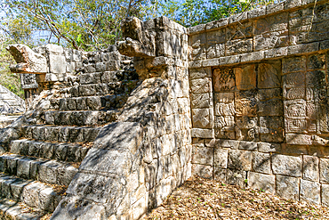 Carved stonework figure, possibly erotic on smaller building, Mayan ruins, Chichen Itza, UNESCO World Heritage Site, Yucatan, Mexico, North America