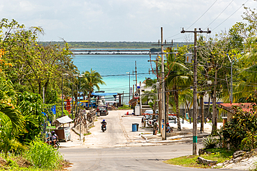 Untidy view down to water, with wires and telegraph poles, Lake Bacalar, Bacalar, Quintana Roo, Yucatan Peninsula, Mexico, North America