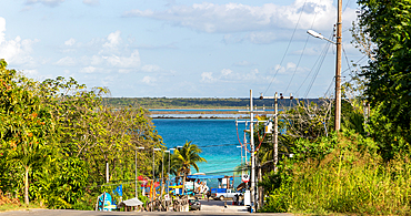 Untidy view down to water, with street lights, poles and wires, Lake Bacalar, Bacalar, Quintana Roo, Yucatan Peninsula, Mexico, North America