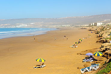 Sandy beach view towards Taghazout, Morocco, North Africa, Africa