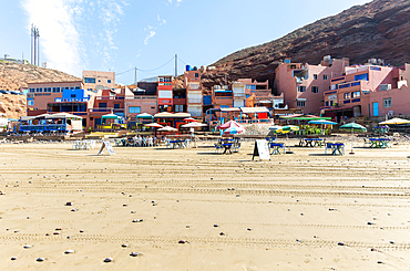 Sandy beach and buildings, Legzira, southern Morocco, North Africa, Africa