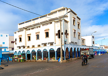 Historic buildings shops and hotel in arcaded shopping street in town centre, Mirleft, southern Morocco, North Africa, Africa