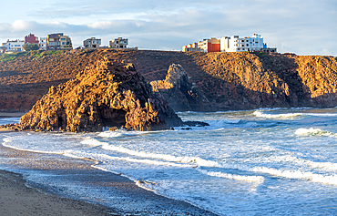 Beach with rocky outcrop on coastline in bay, Plage Sidi Mohammed Ben Abdellah, Mirleft, Morocco, North Africa, Africa