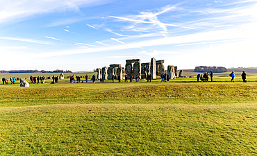 Tourists view standing stones of Neolithic henge, Stonehenge, UNESCO World Heritage Site, Wiltshire, England, United Kingdom, Europe