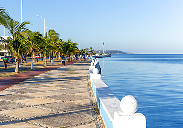 People exercising on pathway by the coast on the seafront Malecon, Campeche city, Campeche State, Mexico, North America