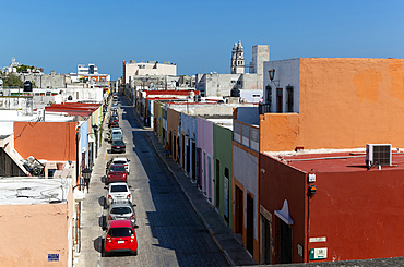 Raised view of street with cars parked and colourful Spanish colonial buildings, Campeche city centre, Campeche State, Mexico, North America