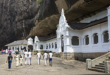 People at Dambulla cave Buddhist temple complex, UNESCO World Heritage Site, Sri Lanka, Asia