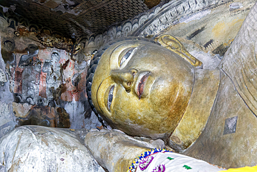 Buddha figure inside Dambulla cave Buddhist temple complex, UNESCO World Heritage Site, Sri Lanka, Asia