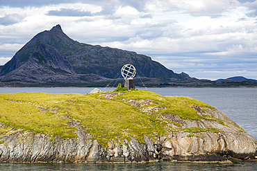 Monument marker to show crossing the Arctic Circle heading south on small island, Norway, Scandinavia, Europe