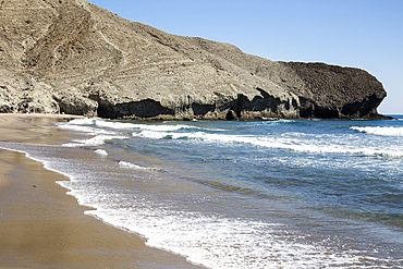 Rocky headland at Playa Monsul sandy beach, Cabo de Gata natural park, Almeria, Andalusia, Spain, Europe