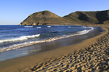 Beach and waves at Playa de Playazo, Rodalquilar, Cabo de Gata natural park, Almeria, Andalusia, Spain, Europe