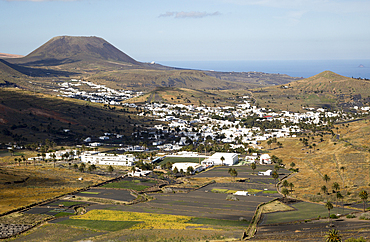 View over whitewashed houses to Monte Corona volcano cone, village of Haria, Lanzarote, Canary Islands, Spain, Atlantic, Europe