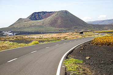 Road leading to cone of Mount Corona volcano and Ye village, Haria, Lanzarote, Canary Islands, Spain, Atlantic, Europe