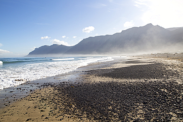 Atlantic Ocean coast beach and waves with morning sea mist, Caleta de Famara, Lanzarote, Canary islands, Spain, Atlantic, Europe