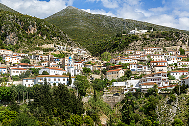 View of whitewashed buildings on mountainside, village of Dhermi, Albania, Europe