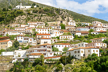 View of whitewashed buildings on mountainside, village of Dhermi, Albania, Europe