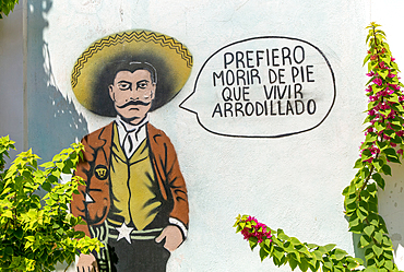 Prefiero morir de pie que vivir arrodillado (I would rather die standing than live kneeling), wall art graffiti of Emiliano Zapata, Merida, Mexico, North America