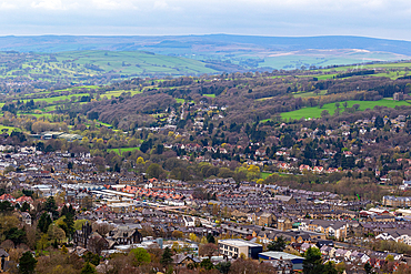 Aerial view of a quaint town nestled in a lush valley with rolling hills in the background in Ilkley, North Yorkshire, England, United Kingdom, Europe