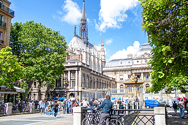 Sunny day in a bustling European city square with historical architecture and pedestrians, Paris, France, Europe