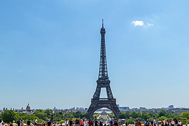 Tourists enjoying a sunny day with a clear view of the Eiffel Tower, Paris, France, Europe