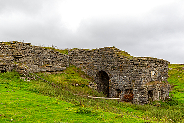 Ancient stone ruins on a grassy hill with overcast skies, North Yorkshire, England, United Kingdom, Europe