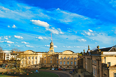 Historic building with a clock tower under a blue sky with fluffy clouds in York, North Yorkshire, England.