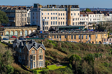 Elegant historical buildings on a hillside with lush greenery in a quaint urban landscape in Bristol, England, United Kingdom, Europe