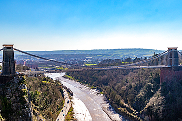 Cifton Suspension Bridge over a scenic gorge with a river, under a clear blue sky in Bristol, England, United Kingdom, Europe