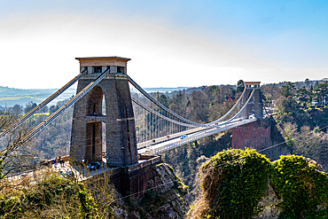 Clifton Suspension Bridge with towers against a clear sky, surrounded by greenery in Bristol, England, United Kingdom, Europe