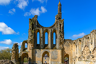 Ancient ruins of a Gothic abbey under a clear blue sky at Byland Abbey, North Yorkshire, England, United Kingdom, Europe