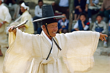 Portrait of a man in traditional costume and tall hat during the Farmers Dance on Wando Island, South Korea, Asia