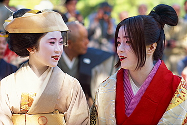 Women wearing traditional Heian period dress, Kyoto, Japan, Asia