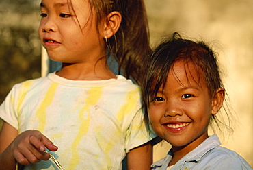 Portrait of two girls at play time in Luang Prabang City, Laos, Indochina, Southeast Asia, Asia