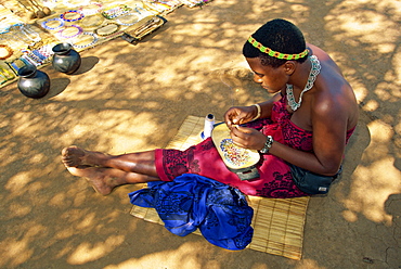 Zulu girl making necklaces, South Africa, Africa