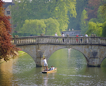 Punting on the River Cam in The Backs with Clare Bridge behind and King's Bridge in the distance, Cambridge, Cambridgeshire, England, UK