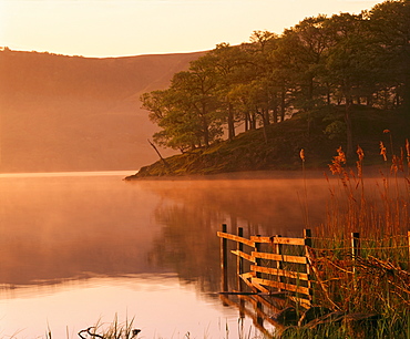 Mist rising on Derwent Water at dawn, Lake District National Park, Cumbria, England, United Kingdom, Europe