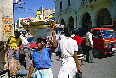 Street scene, including woman carrying goods on head, Port au Prince, Haiti, Caribbean, Central America