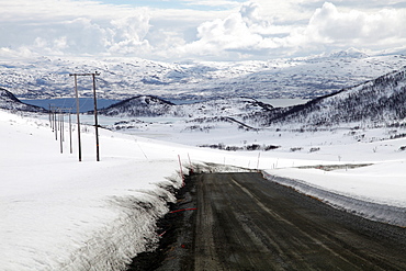 Mountain road in spring, Kvaloya (Whale Island), Troms, arctic Norway, Scandinavia, Europe